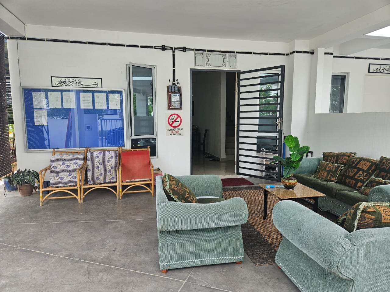 Covered veranda seating area with Islamic calligraphy, Gerbang Dzunnurayn