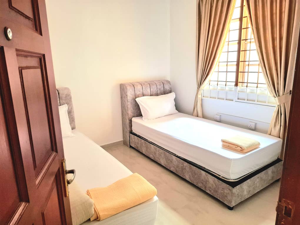 RH Elderly Care Centre twin bedroom with fresh towels and AC