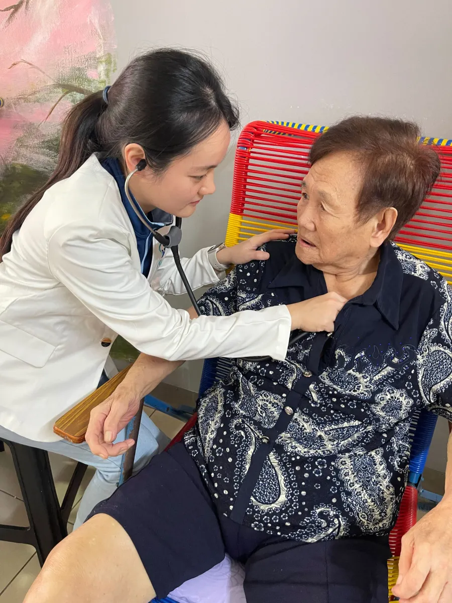Resident doing activity with carer at EHA ElderCare - Grandview KL branch