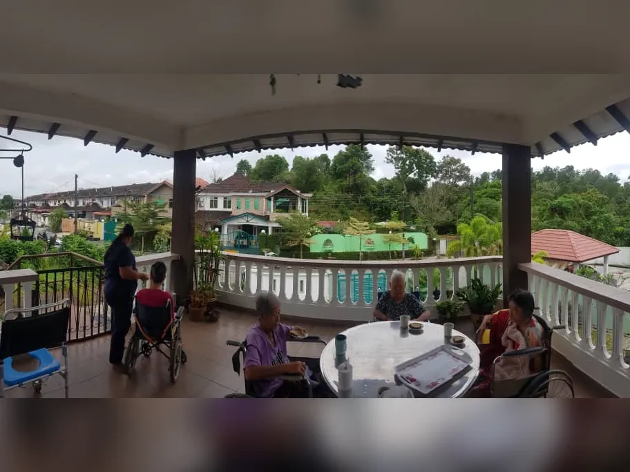 Balcony view with residents and green surroundings at Green Acres JB
