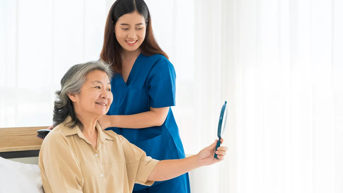 Caregiver and resident at Genesis Life Care