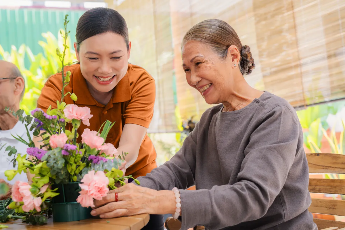 Care Collective Kuching caregiver with resident