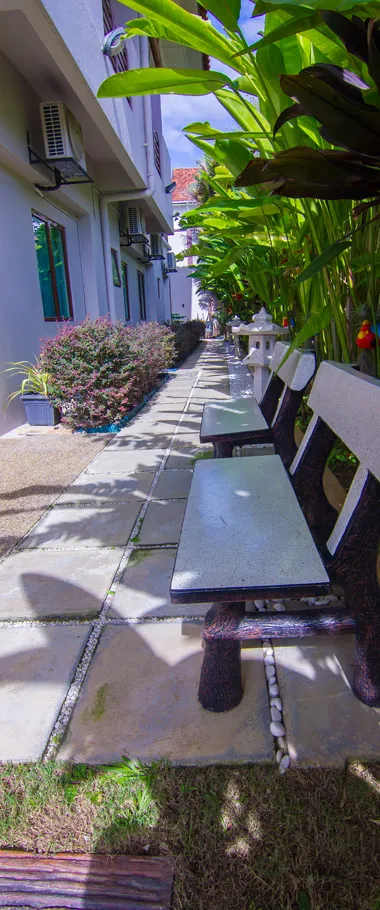 Garden pathway and seating at Meridian Care Living, Bangsar