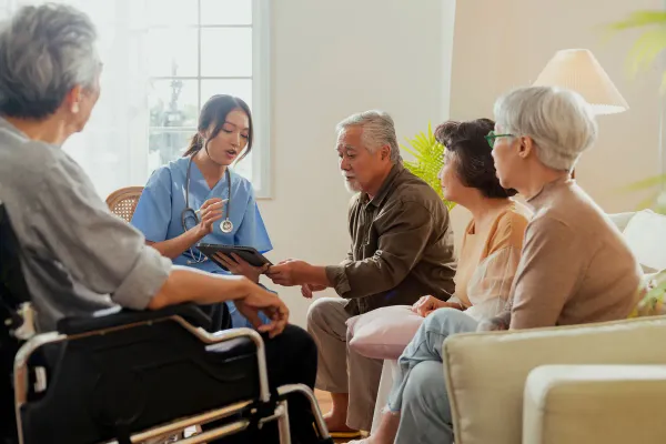 KindNest Care Centre KL caregiver with senior residents group session