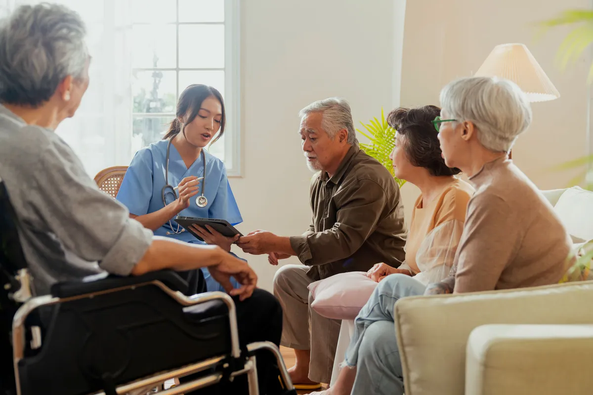 KindNest Care Centre KL caregiver with senior residents group session